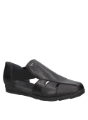 Sandalia negra de cuero para mujer, estilo casual, taco plano y punta redonda.