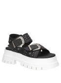 Sandalia negra de cuero con tachas para mujer, diseño contemporáneo y vanguardista.