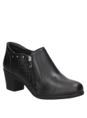 Botín negro de cuero para mujer con diseño moderno y elegante, cierre lateral de cremallera y relieve tipo piel de reptil.