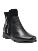 Botín negro de cuero para mujer, adecuado para faldas midi o vestidos, perfecto para un look semiformal.