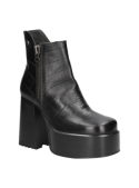 Botín negro de cuero con diseño chunky y funcionalidad moderna, versátil para eventos nocturnos o paseos urbanos.
