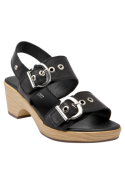 Sandalia boho-chic de cuero negro para mujer, detalles decorativos de ojetillos metálicos, ideal para un look urbano.