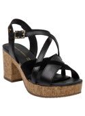 Sandalia casual de cuero negro con correa ajustable en el tobillo y hebilla para un ajuste seguro.