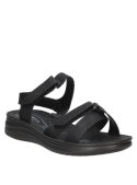 Sandalia negra athleisure para mujer, con correas ajustables, ideal para vacaciones y caminatas largas.