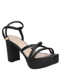 Sandalia de cuero negro con plataforma, versátil para un look formal o casual chic con jeans y blusa elegante.