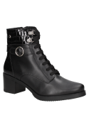 Botín casual de cuero negro para mujer, con diseño elegante y versátil, adecuado para salidas diurnas y nocturnas.