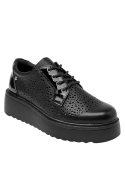 elegante zapatilla de cuero negra para mujer, con forro de poliuretano y estilo juvenil para uso diario.