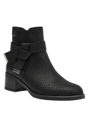 Versátil botín Chelsea de cuero negro para mujer, con detalles elegantes y taco que ofrece comodidad y estabilidad.