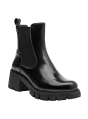 Calzado de cuero negro tipo Chelsea para mujer, con suela dentada y diseño elegante, perfecto para un look moderno.