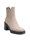 Femenino botín beige Chelsea de cuero, adecuado para looks casuales y elegantes.