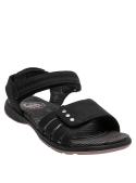 Sandalia sintética negra, ideal para paseos al aire libre y ropa veraniega.