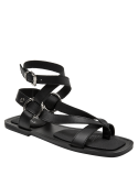 Calzado plano minimalista en cuero negro para mujer, cómodo y elegante.