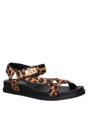 Cuero animal print en sandalia plana de mujer, estilo minimalista para un toque casual y ligero.