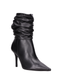 Botas formales para mujer en negro, combinan con vestidos de cóctel y jeans ajustados.